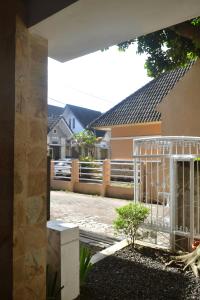 a view of a house with a fence at Cipta Guesthouse in Yogyakarta
