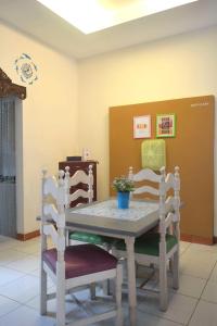a table and two chairs in a room at Cipta Guesthouse in Yogyakarta