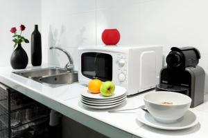 Kuchyňa alebo kuchynka v ubytovaní Hostal Nitzs Bcn