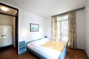 Postel nebo postele na pokoji v ubytování Apartments Astra + 22 fotografií