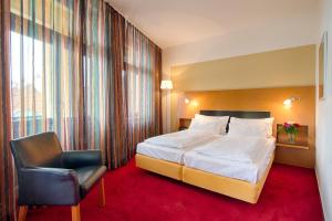 Posteľ alebo postele v izbe v ubytovaní Theatrino Hotel