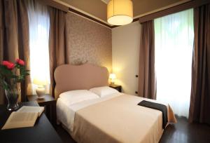 A bed or beds in a room at Relais La Placa