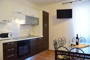 Kuchyň nebo kuchyňský kout v ubytování Residence Segattini