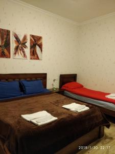 Ένα ή περισσότερα κρεβάτια σε δωμάτιο στο Alma-Ata Hotel
