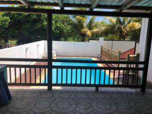 a view of a swimming pool from a balcony at Aashsweet Villa in Calodyne