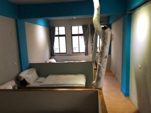 Letto o letti in una camera di 一個好人民宿 青年旅舍衛浴共用的超級小隔間 花蓮縣民宿2410號