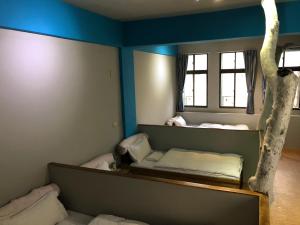 Letto o letti in una camera di 一個好人民宿 青年旅舍衛浴共用的超級小隔間 花蓮縣民宿2410號
