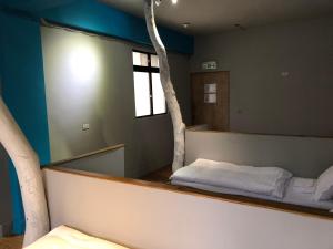 Letto o letti in una camera di 一個好人民宿 青年旅舍衛浴共用的超級小隔間 花蓮縣民宿2410號
