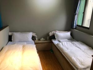 Letto o letti in una camera di 一個好人民宿 青年旅舍衛浴共用的超級小隔間 花蓮縣民宿2410號