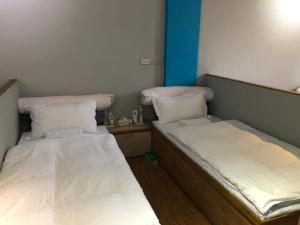 Letto o letti in una camera di 一個好人民宿 青年旅舍衛浴共用的超級小隔間 花蓮縣民宿2410號