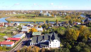an aerial view of a small town next to a river at Kremlyovsky Hotel in Suzdal
