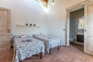 Posteľ alebo postele v izbe v ubytovaní Relais del Lago e Relais del Monte