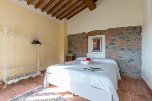 Posteľ alebo postele v izbe v ubytovaní Relais del Lago e Relais del Monte