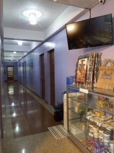 TV o dispositivi per l'intrattenimento presso Mayon Lodging House