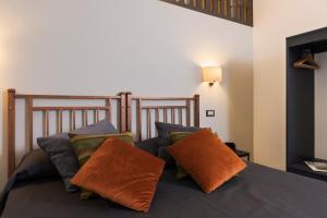 A bed or beds in a room at Cavour Suites Guest House