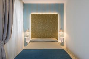 A bed or beds in a room at Cavour Suites Guest House