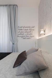 A bed or beds in a room at Cavour Suites Guest House