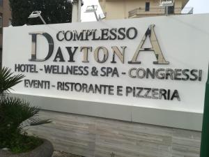 a sign for a hotel villas and spa at Hotel Daytona Palace in Casoria