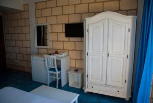 TV a/nebo společenská místnost v ubytování CapoSperone Resort