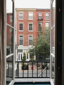 an open window with a view of a building at Lokal Hotel Old City in Philadelphia