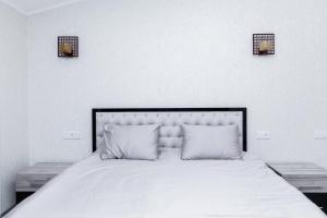 Voodi või voodid majutusasutuse Loft Modern Premium toas