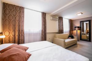Säng eller sängar i ett rum på Hotel Evropa
