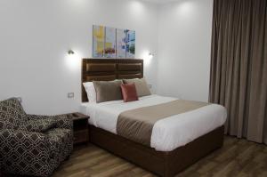 Ένα ή περισσότερα κρεβάτια σε δωμάτιο στο Violet 133