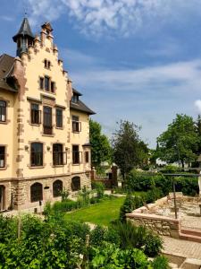 an old building with a garden in front of it at GUT LEBEN am Morstein in Westhofen