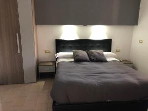 Ένα ή περισσότερα κρεβάτια σε δωμάτιο στο Hotel Nettuno