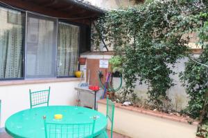 a table and chairs in front of a building at Gmax Guelfa Apartments in Florence