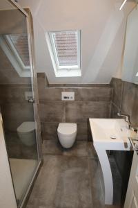 Ένα μπάνιο στο Central Apartment Rödermark 3SZ