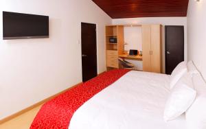 Postel nebo postele na pokoji v ubytování Hotel TuKasa Inn + 37 fotografií