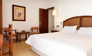 Postel nebo postele na pokoji v ubytování Hotel Antonio