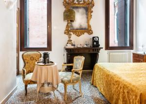 Postel nebo postele na pokoji v ubytování Luxury Venetian Rooms