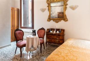 Postel nebo postele na pokoji v ubytování Luxury Venetian Rooms