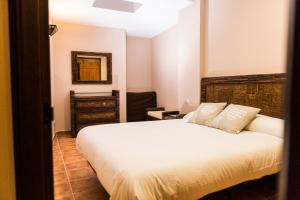 Postel nebo postele na pokoji v ubytování Casa Rural Tio Mora