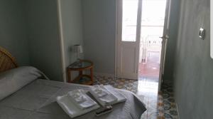 Un pat sau paturi într-o cameră la La Maison de Leo Appartamento