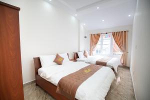 Postel nebo postele na pokoji v ubytování Mỹ Kim Villa
