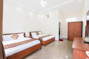 Postel nebo postele na pokoji v ubytování Mỹ Kim Villa
