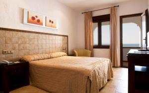 Postel nebo postele na pokoji v ubytování Hotel Antonio