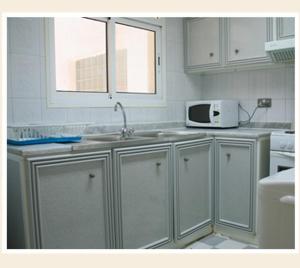 Kuchyň nebo kuchyňský kout v ubytování Royal Plaza Hotel Apartments + 13 fotografií