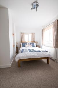 a bedroom with a bed and a window at Southern Breeze Lodge - Adults Only in Bournemouth