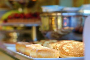 a plate of donuts sitting on a table at Il Giardino Di Albaro in Genoa +15 photos