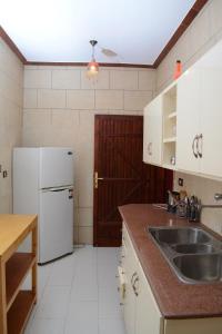 Kuchyň nebo kuchyňský kout v ubytování Harmony House Luxor