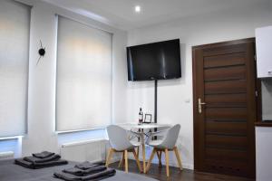 Televízia a/alebo spoločenská miestnosť v ubytovaní Studio Fibra Dolce