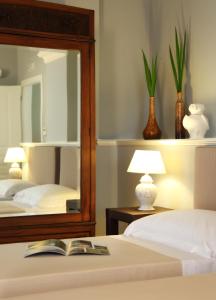 A bed or beds in a room at Relais La Placa