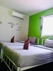 Postel nebo postele na pokoji v ubytování Grand Beach Resort