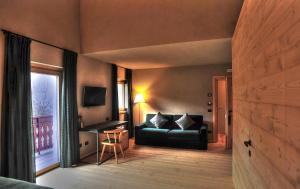 Posezení v ubytování Alpi & Golf Hotel