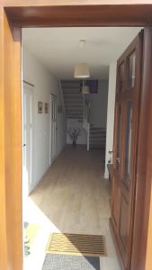 an open hallway with a staircase in a house at Wyskok 1 - dom z widokiem in Srokowo