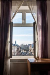 a window with a view of a city at WONDER CRACOW in Krakow